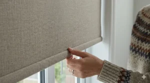 A close-up of premium blackout roller blind fabric showing its thick, light-blocking texture.