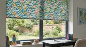 Playful multi-coloured geometric patterned roller blinds for a child's bedroom