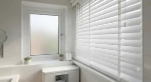 Dark wood-effect waterproof blinds providing privacy in a neutral-toned family bathroom