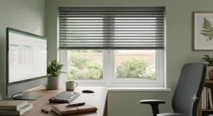 Stylish grey easy fit venetian blinds providing light control in a home office space