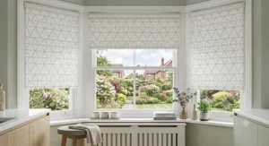 Scandi-inspired light grey geometric roller blinds in a modern kitchen
