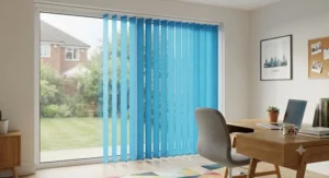 Bright blue replacement vertical blind slats filtering natural daylight in a home office space.