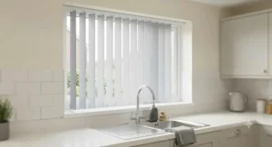 Durable waterproof PVC replacement vertical blind slats installed in a kitchen above a sink.