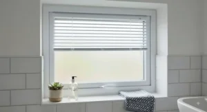Moisture-resistant best perfect fit blinds fitted securely on a small frosted bathroom window