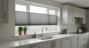 Contemporary grey no drill pleated blinds installed on a kitchen window for privacy and light control
