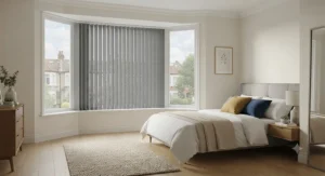 Made-to-measure blackout vertical blinds in a stylish neutral tone installed in a modern UK bedroom for total light control.