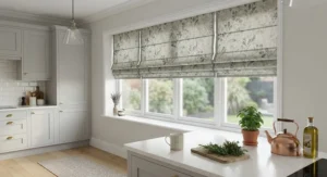 Contemporary kitchen window dressed with patterned best blackout roman blinds featuring a subtle botanical print.