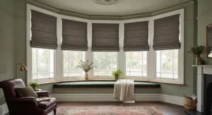 Traditional Victorian bay window styled with tailored best blackout roman blinds to keep out draughts and morning sunlight.