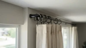 Curtain rings smoothly gliding along a bendable curtain pole for bay window around a sharp corner