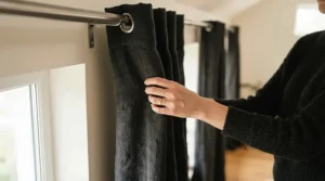 Illustration demonstrating the thick fabric weight of the best blackout curtains in a modern flat