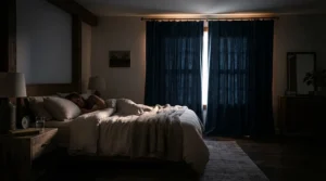 Cheap lined pencil pleat curtains keeping a bedroom warm and dark