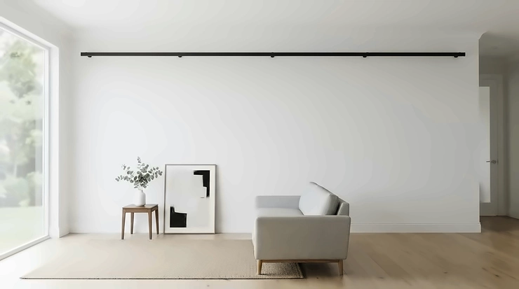 An extendable curtain pole for large windows styled in a contemporary minimalist interior design.